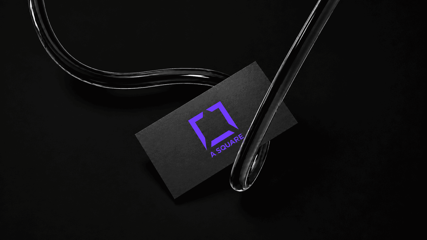 A SQUARE logo card suspended by a glass tube